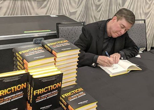 Roger Dooley signing copies of Friction in person