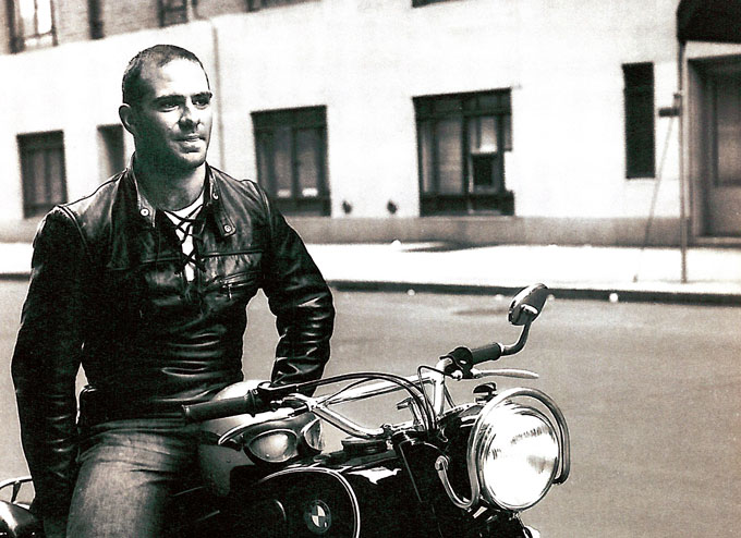 black and white image of Oliver Sacks sitting on a motorcycle