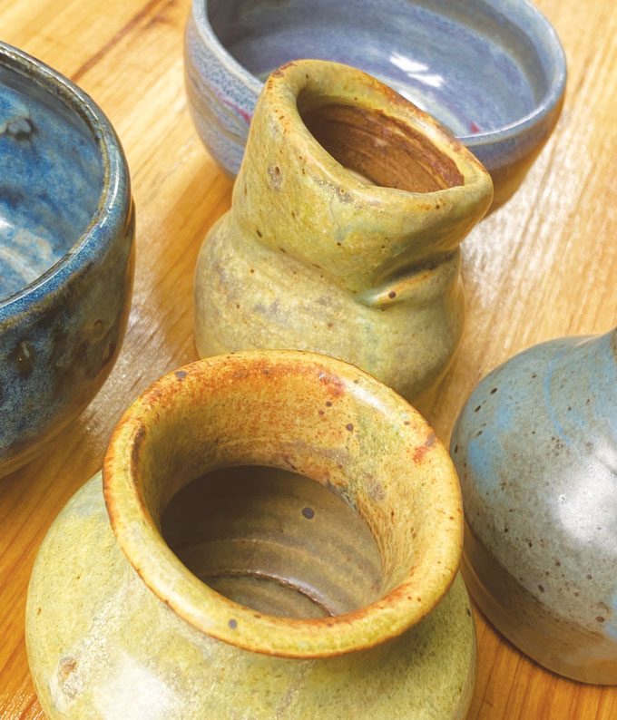 image of yellow and blue vases, bowls and cups